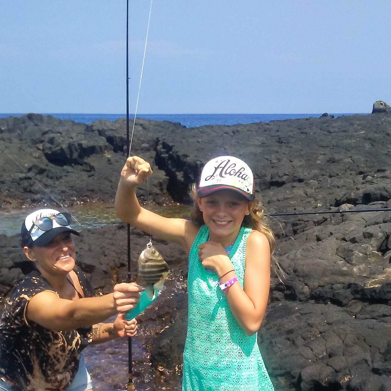 girl holding a tropical fish