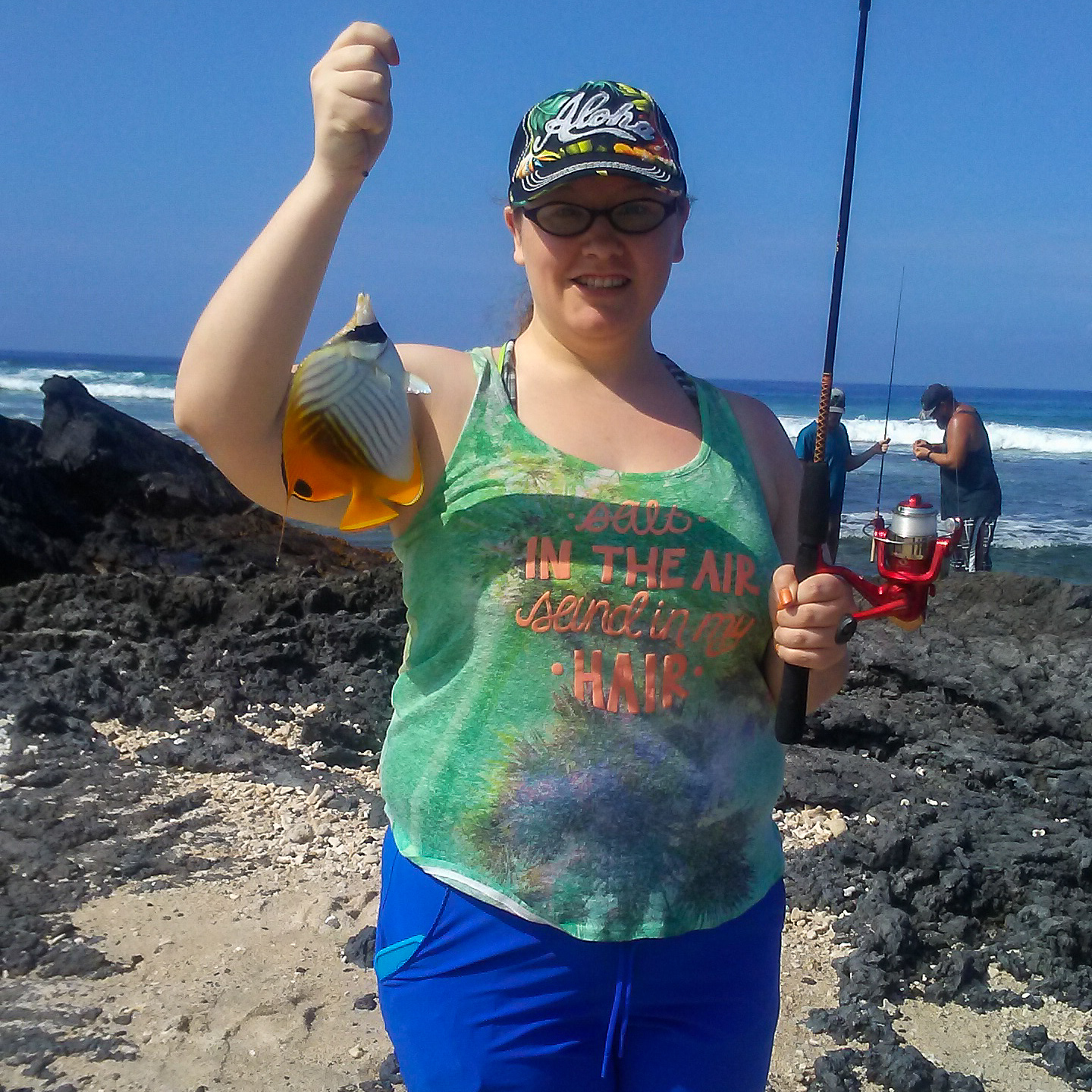 woman holding an orange fish